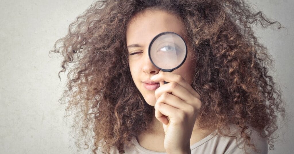 6 Things I Worry About as a Woman After the Latest U.S. Election 6 Thoughtful woman looking out window reflecting on political news