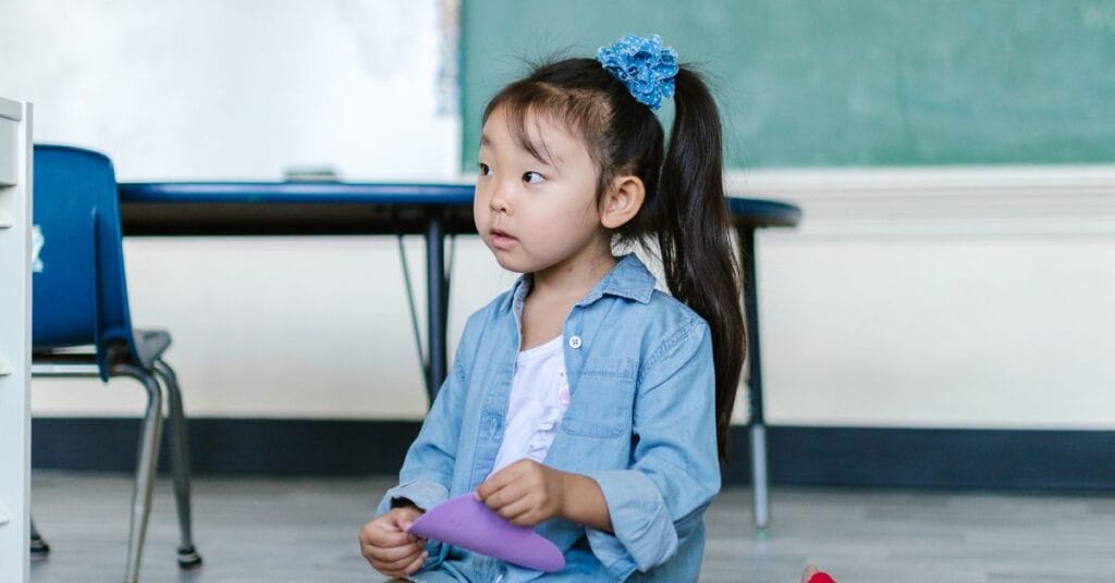 Children in a classroom looking bored and uninspired