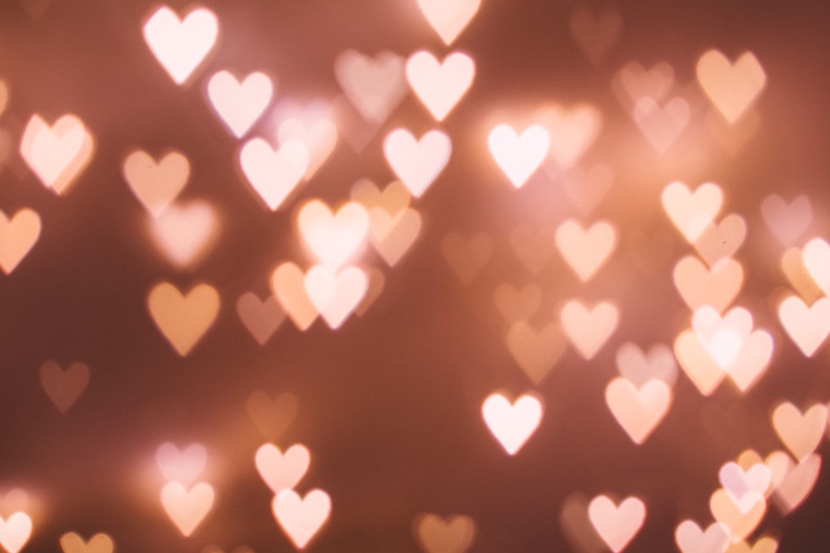 Romantic couple in an intimate moment with golden warm lighting, representing healthy relationship and love