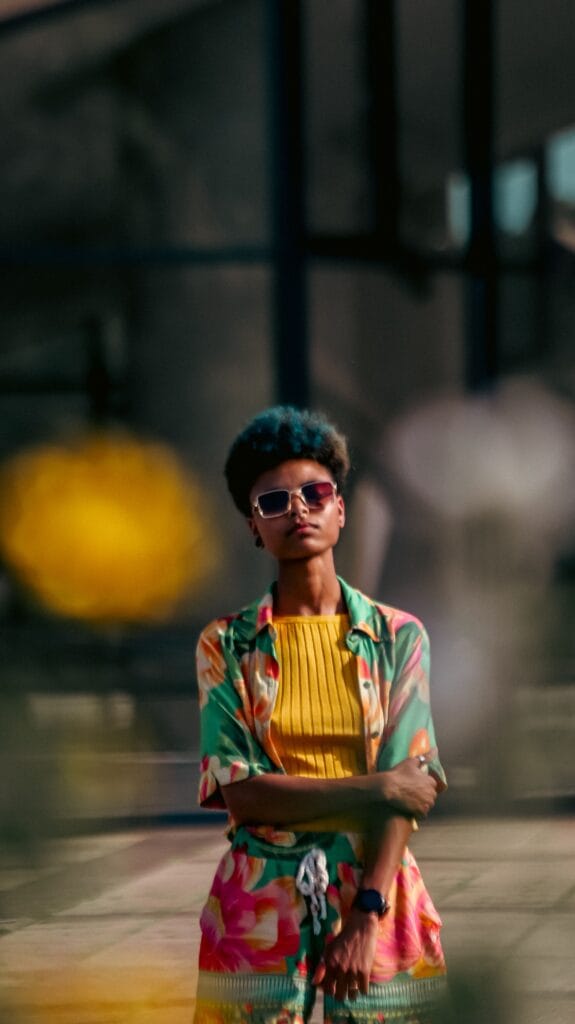 Confident woman in colourful outfit embracing Brat Girl Summer energy