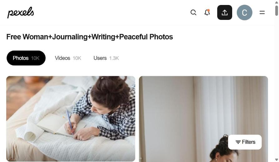 Woman writing peacefully in a journal on her bed - healing power of journaling