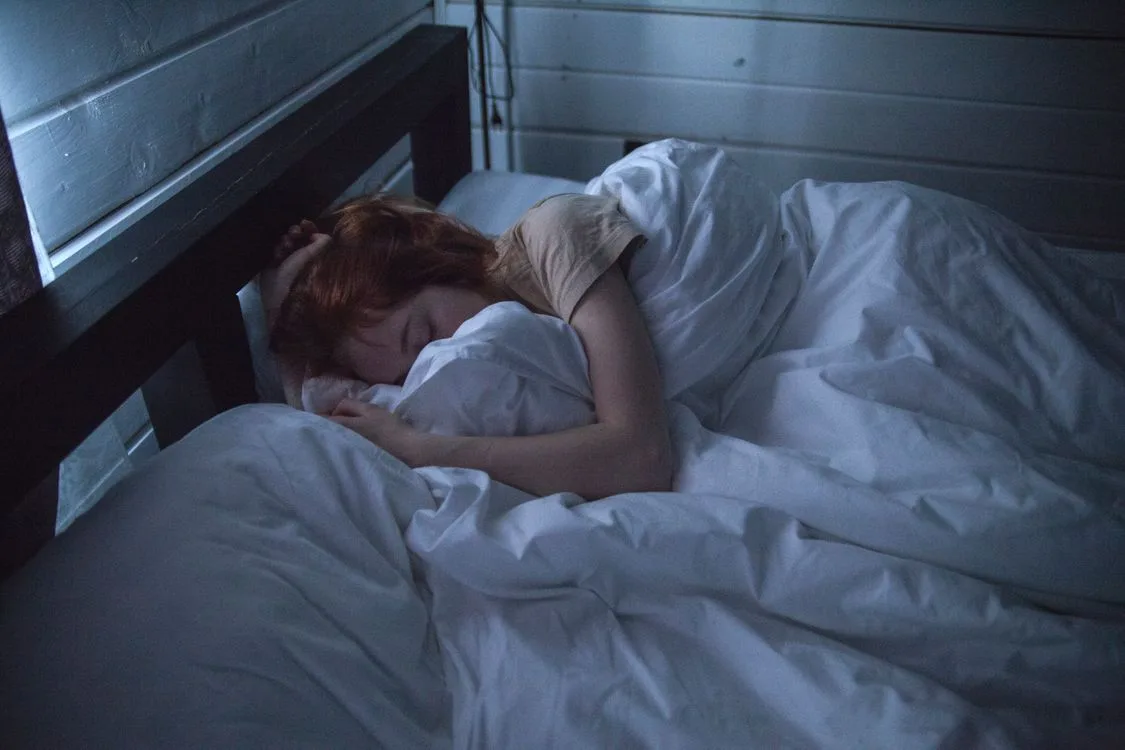 woman awake in bed overthinking at night — how to stop overthinking at night