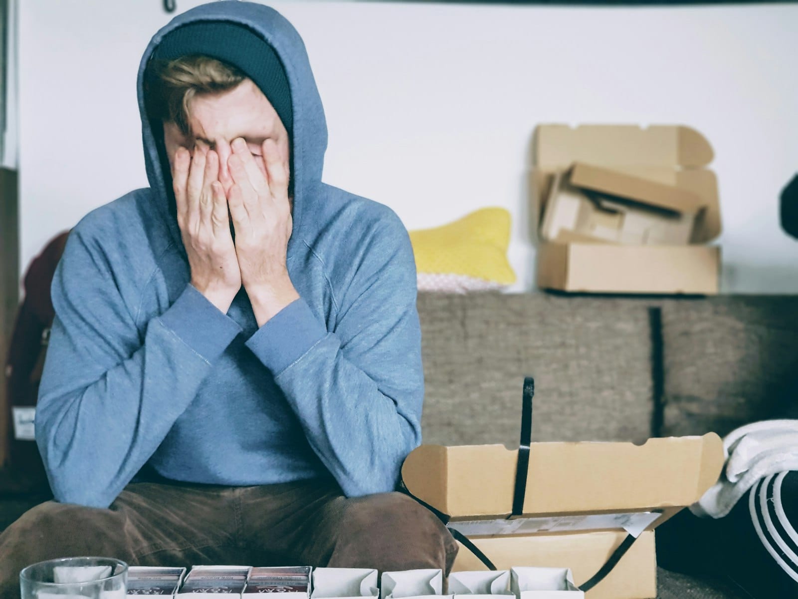Gaslighting in Relationships: 9 Signs Someone Is Rewriting Your Reality 2 Person covering their face with both hands in emotional distress